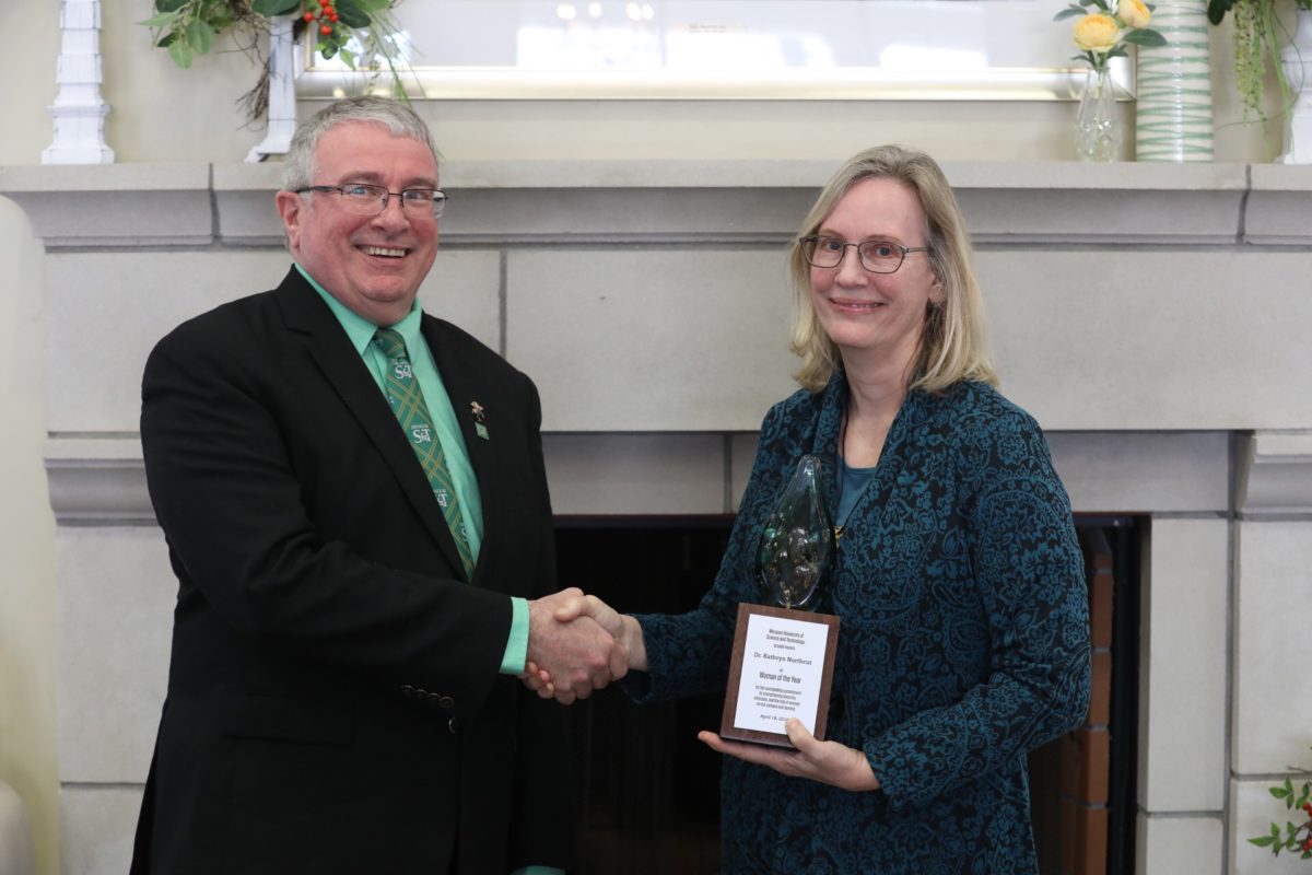 Interim Chancellor Chris Maples presents Dr. Kathryn Northcut with the Missouri S&T 2018 Woman of the Year award.