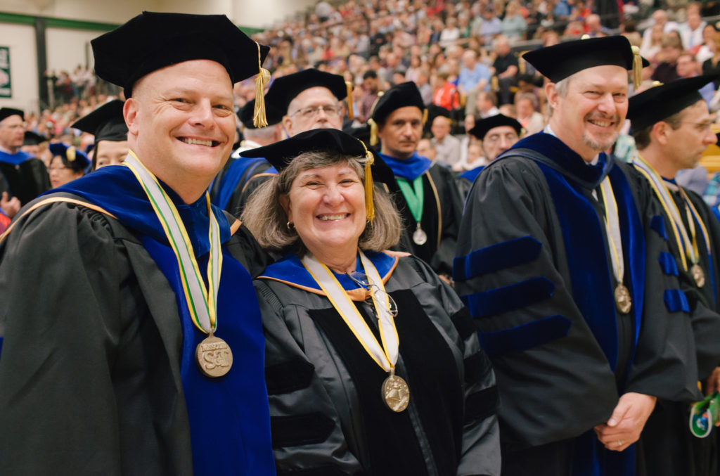faculty members standing at commencement