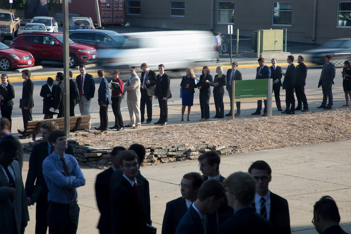 Line of students in suits