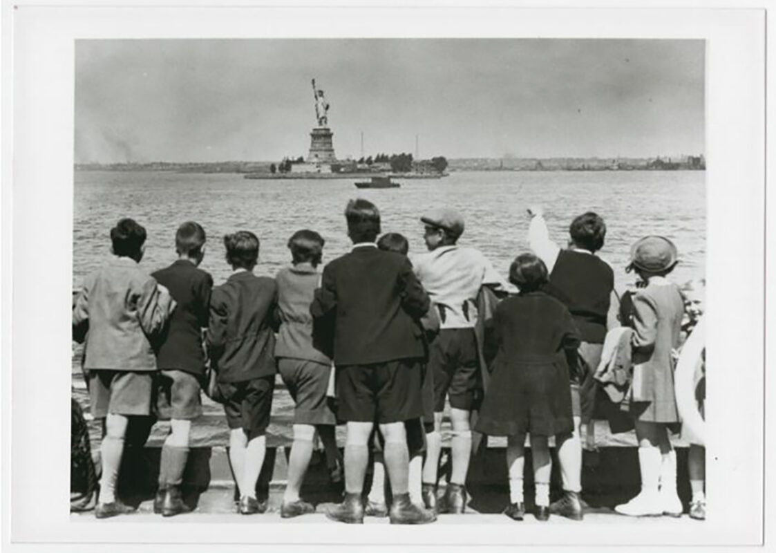 Refugee children look out at the Statue of Liberty as they pull into New York Harbor. Photo credit: U. S. Holocaust Memorial Museum, courtesy of Steve Pressman.
