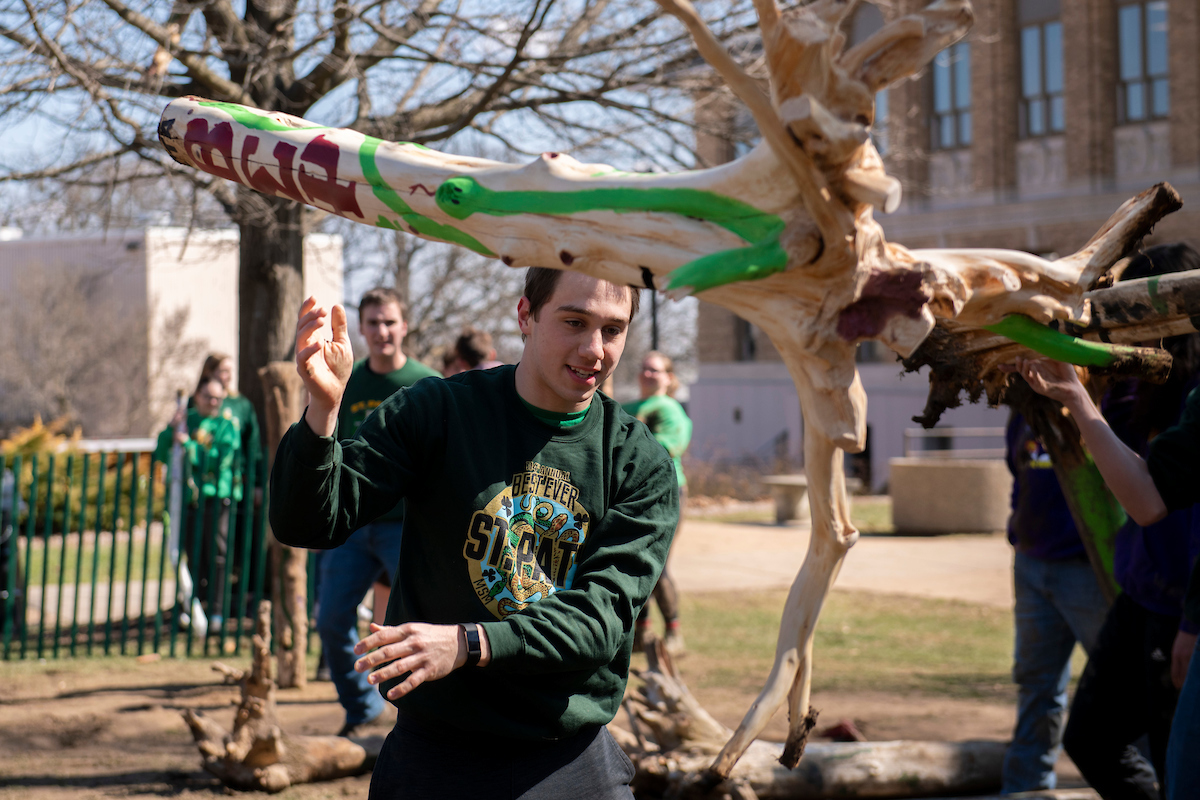 Student throwing a cudgel in the snake pits in 2022.