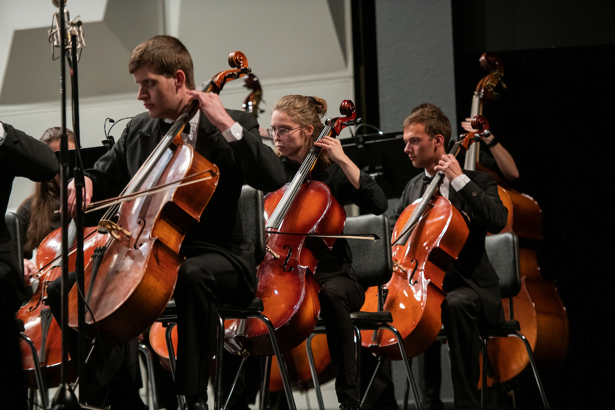 Students playing cellos.