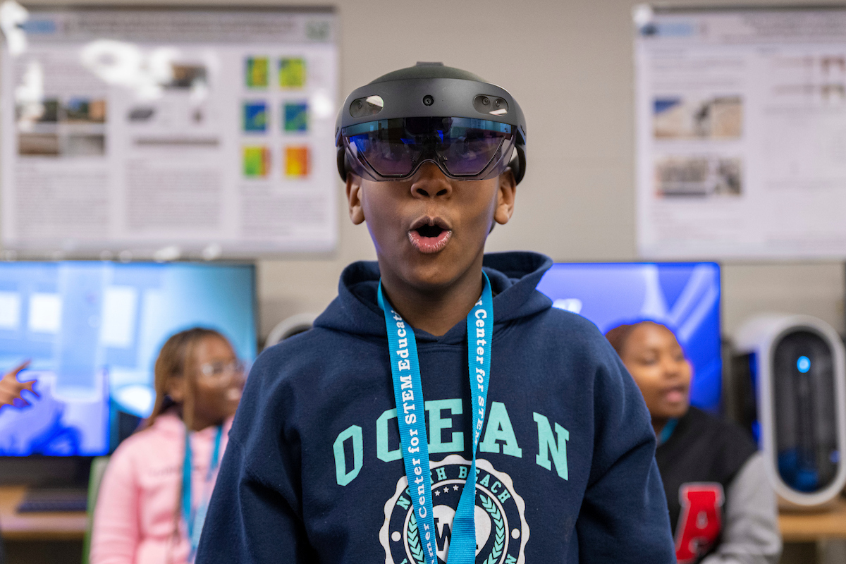 A young student wearing a virtual reality headset.