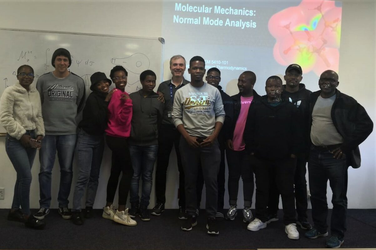 Vadym poses with students from the University of the Western Cape.