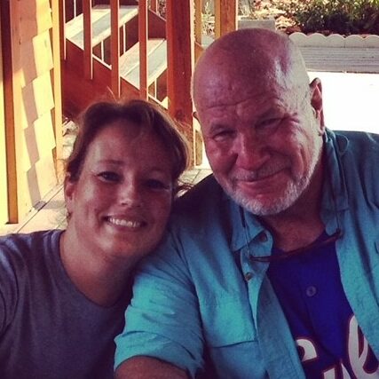 Anne posing with her favorite author, Randy Wayne White, at a book signing.
