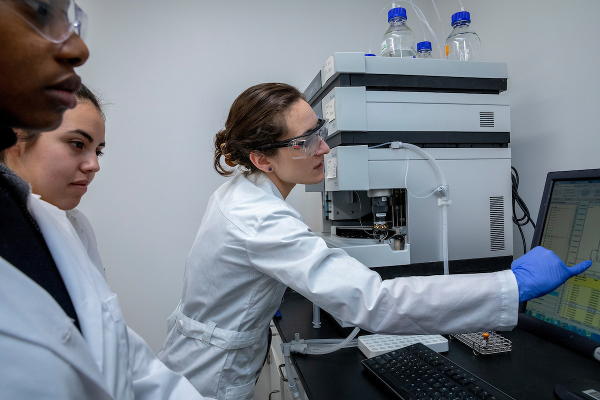 Women researchers in lab coats.