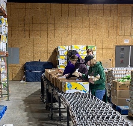 Students packing boxes at the Phelp's County Dream Center last spring. Photo Credit: Mark Potrafka.