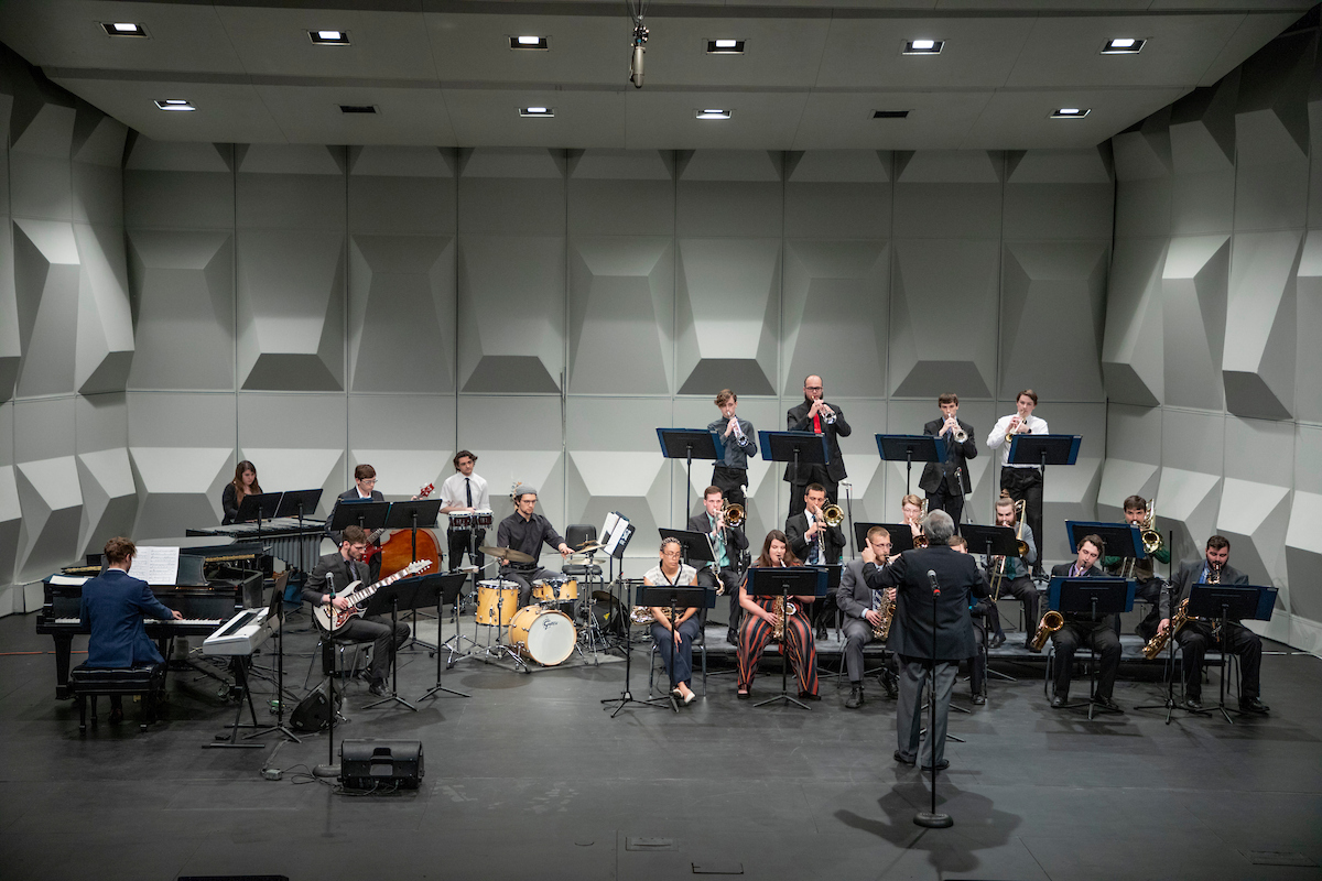 Jazz band plays music on concert stage.