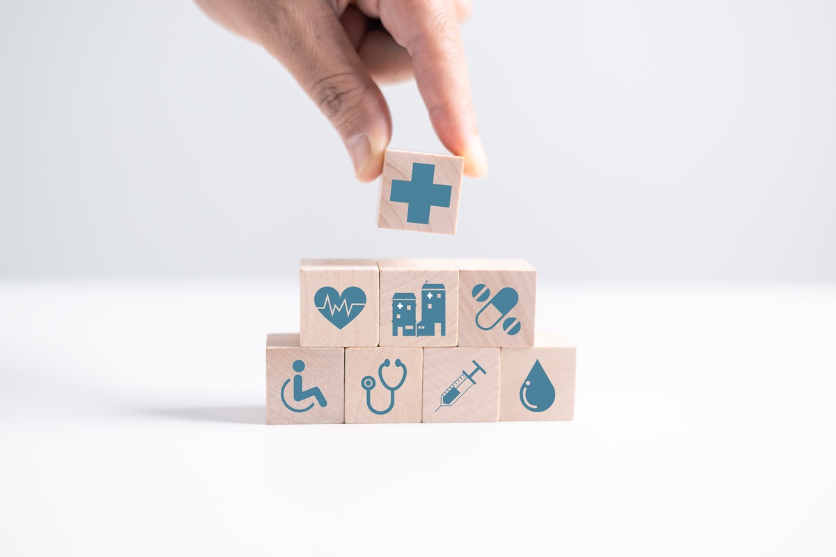 Wooden blocks with health related symbols on them.