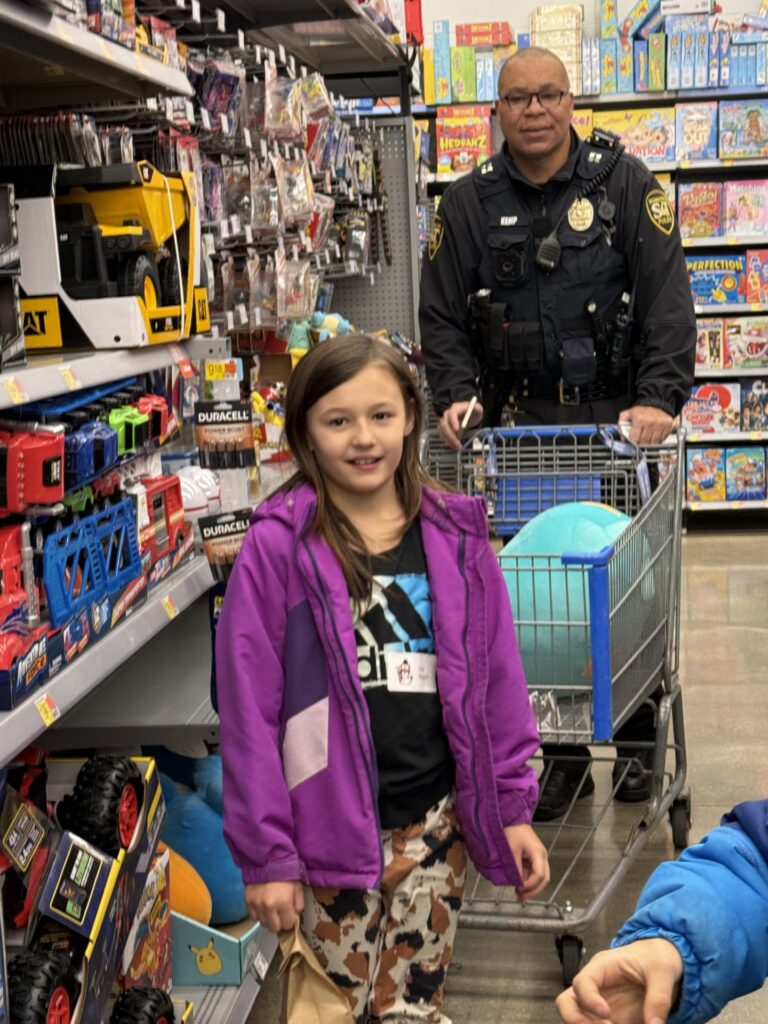 Oscar Kemp shops with child. 