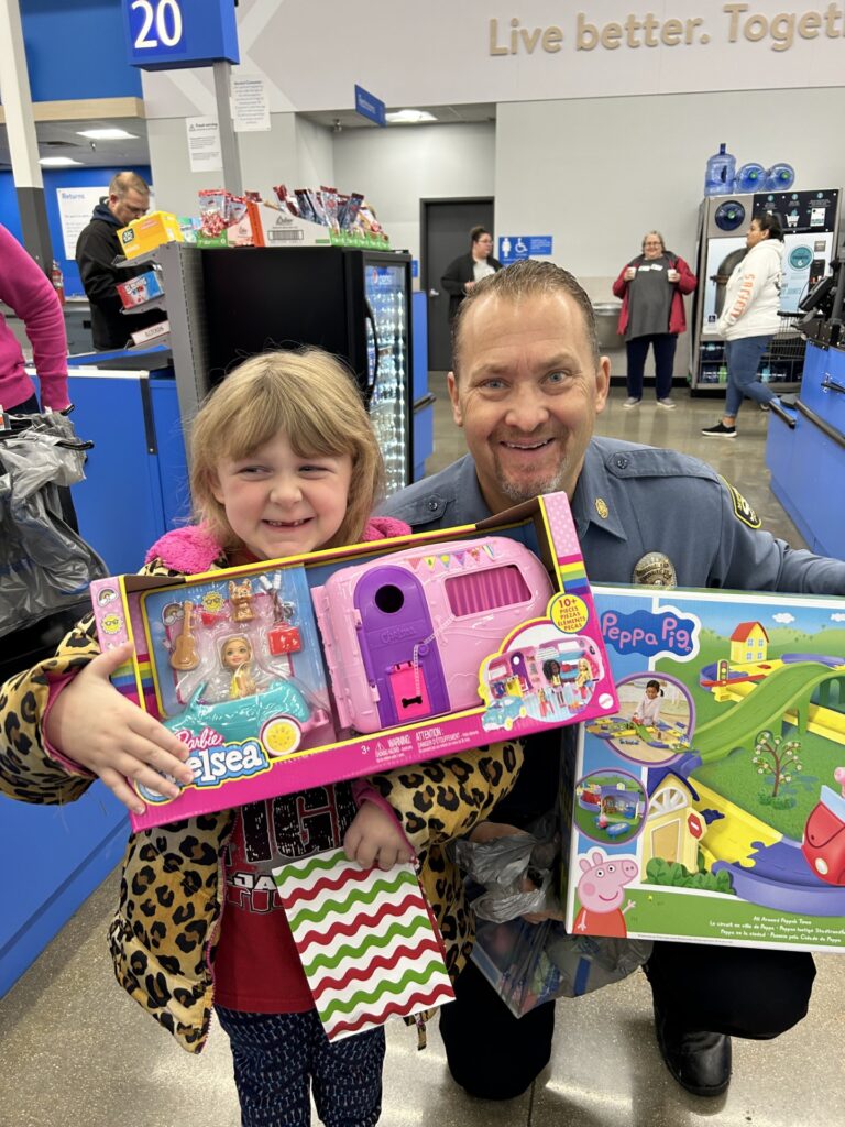 Chief Roberts shops with child.