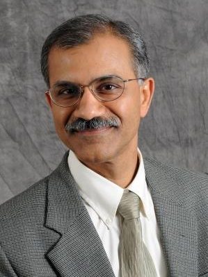 Professional headshot of Dr. K. Krishnamurthy.