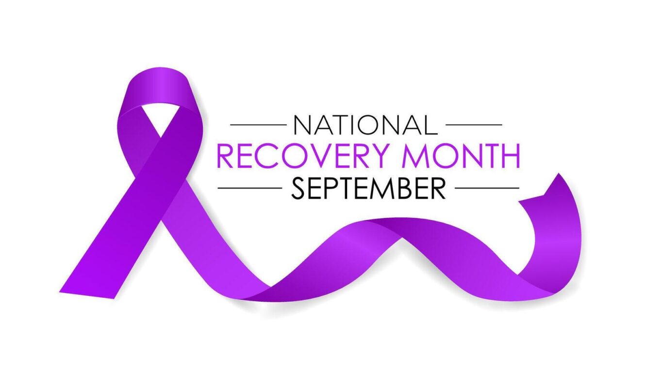 A flowing purple ribbon with the text "NATIONAL RECOVERY MONTH SEPTEMBER" against a white background.